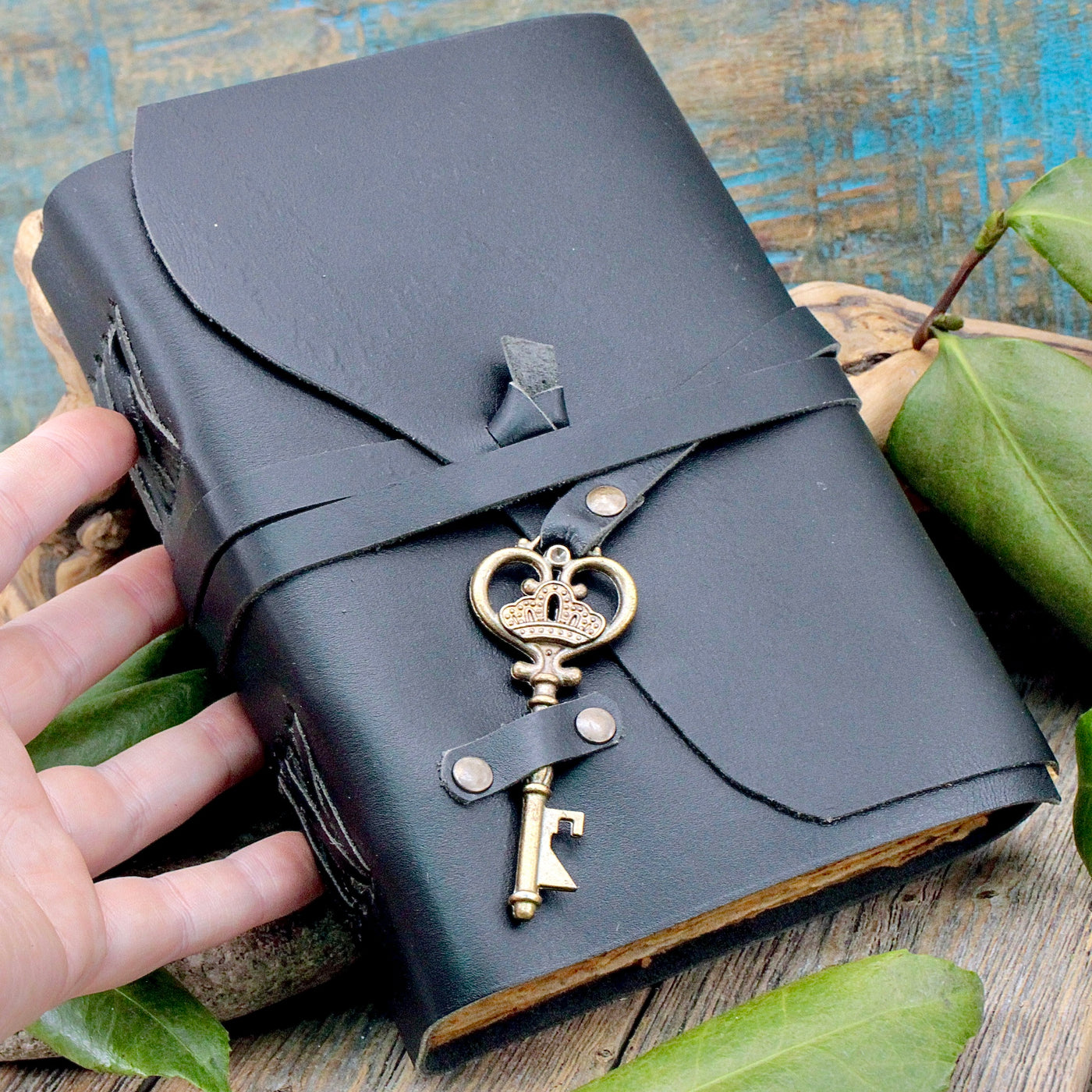 Black Leather Journal with Key Closure hand
