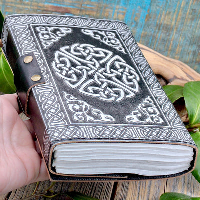 Black leather Pentacle Journal hand