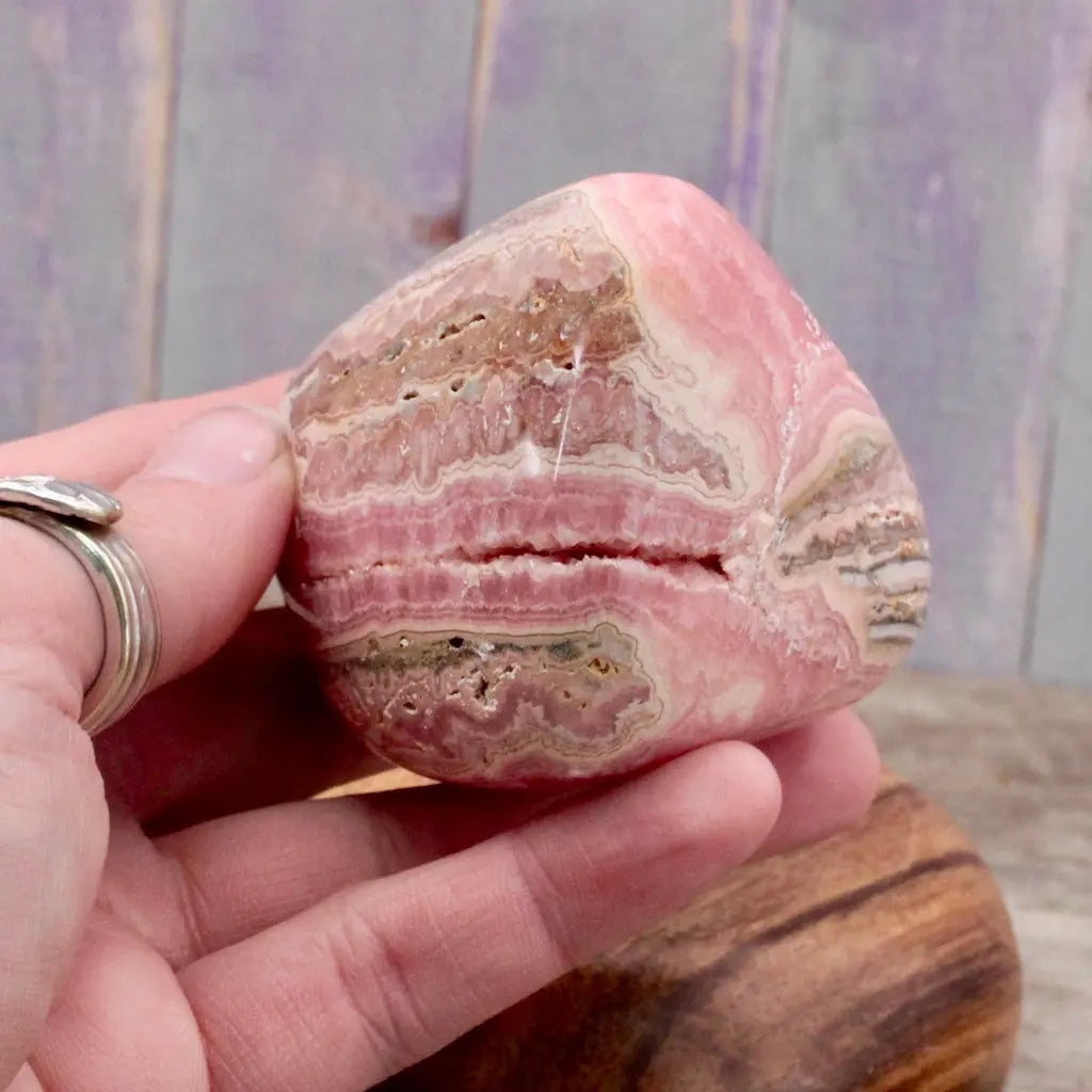 Rhodochrosite Freeform in hand